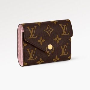 Classic Louis Vuitton Victorine wallet in Monogram. Original packaging included.